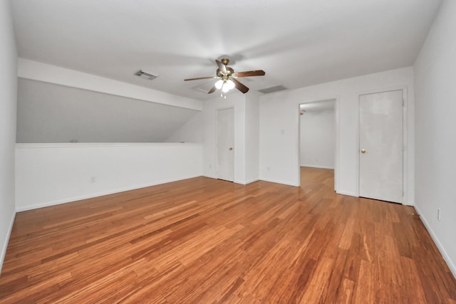 bonus room with hardwood / wood-style flooring, ceiling fan, and lofted ceiling