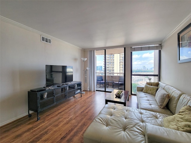 living room with dark hardwood / wood-style floors, expansive windows, and ornamental molding