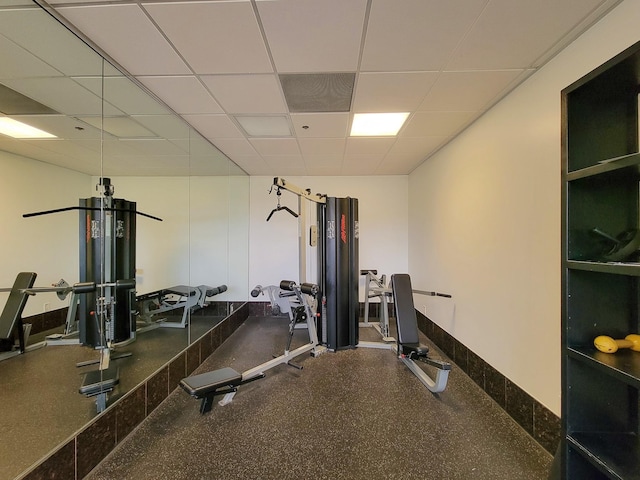 workout room featuring a drop ceiling