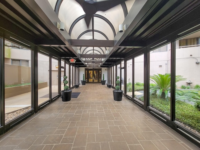 unfurnished sunroom with a wealth of natural light