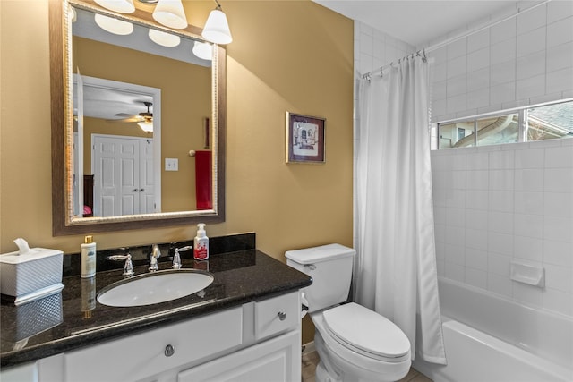 full bathroom with shower / tub combo, vanity, toilet, and ceiling fan