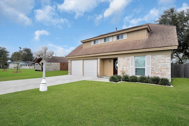 view of front of house with a garage and a front lawn