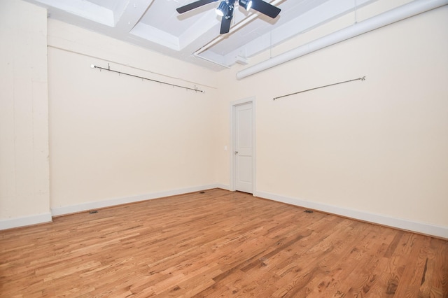 spare room featuring hardwood / wood-style flooring and ceiling fan