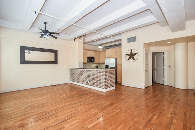 unfurnished living room featuring ceiling fan, beam ceiling, and light hardwood / wood-style flooring