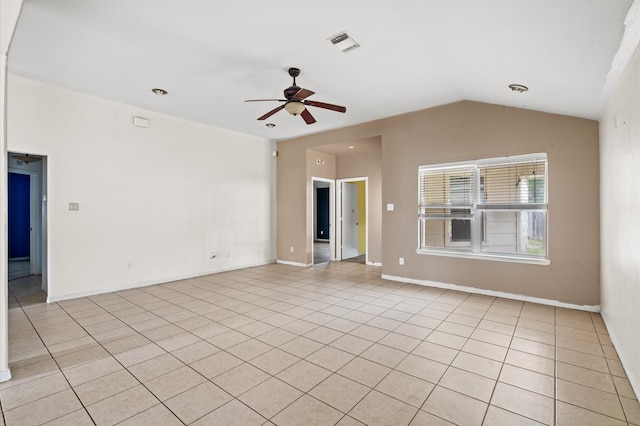 tiled empty room featuring ceiling fan and lofted ceiling