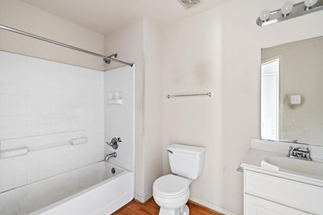 full bathroom featuring shower / bathing tub combination, toilet, vanity, and hardwood / wood-style flooring