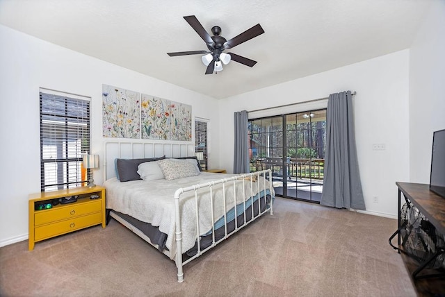 bedroom with carpet flooring, ceiling fan, access to outside, and multiple windows