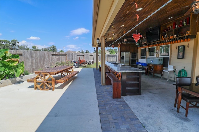 view of patio featuring a bar