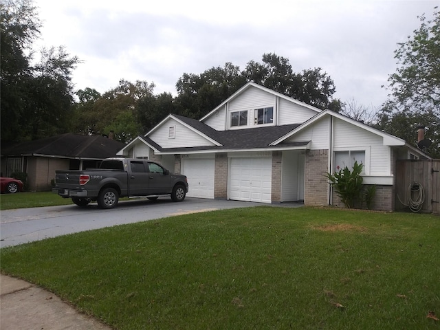 view of front of house with a front yard and a garage