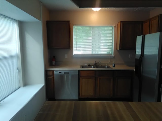 kitchen featuring a healthy amount of sunlight, sink, and stainless steel appliances