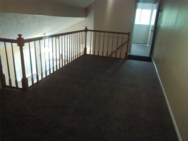 hallway with carpet flooring