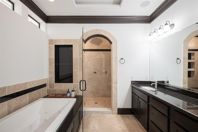 bathroom featuring vanity, ornamental molding, and independent shower and bath