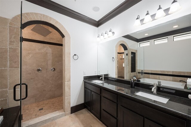 bathroom featuring crown molding, a shower with shower door, and vanity