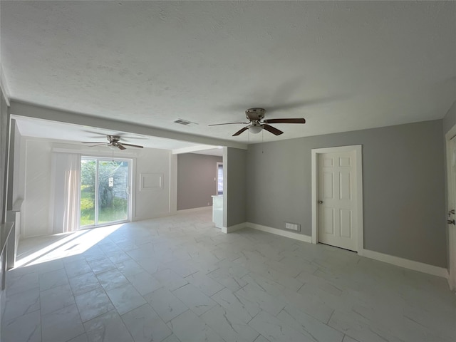 spare room featuring ceiling fan