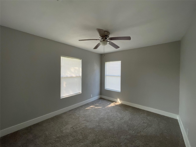 carpeted spare room with ceiling fan