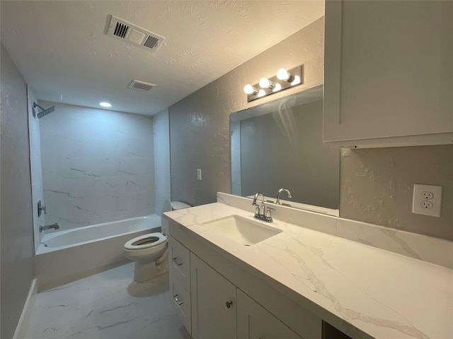 full bathroom featuring tiled shower / bath combo, toilet, and vanity