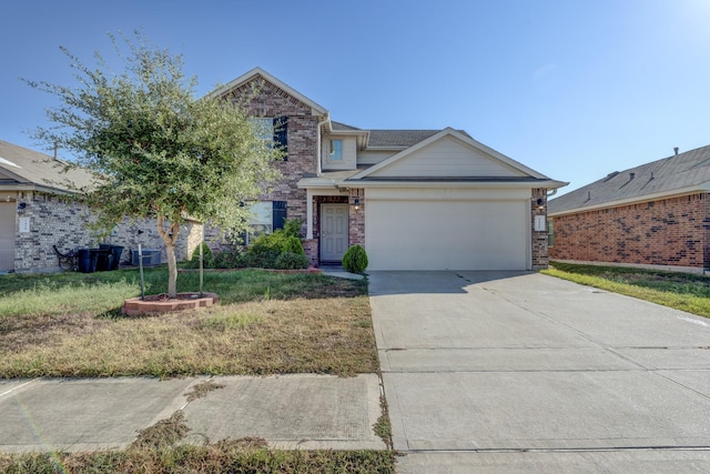 view of front of property featuring a garage and a front lawn