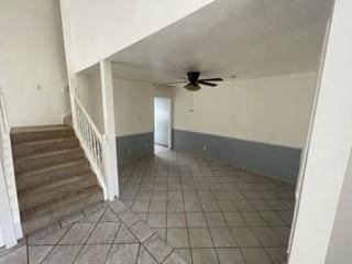 unfurnished living room with ceiling fan