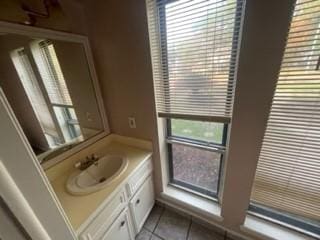 bathroom featuring tile patterned flooring and vanity