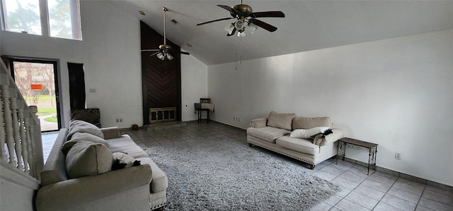 living room with tile patterned floors, ceiling fan, and high vaulted ceiling