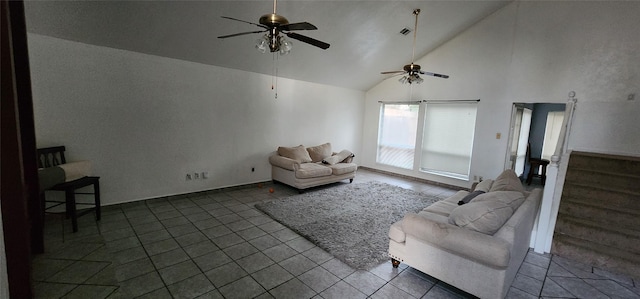 unfurnished living room featuring high vaulted ceiling, dark tile patterned flooring, and ceiling fan