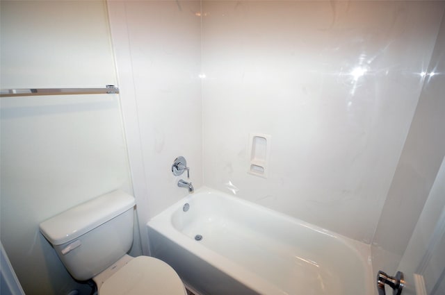 bathroom with toilet and shower / washtub combination