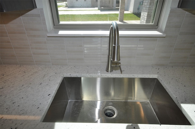 room details with backsplash and sink