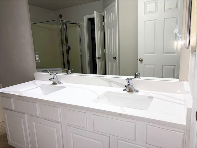 bathroom with vanity and walk in shower