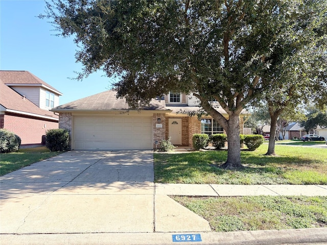 view of front of home featuring a garage and a front yard