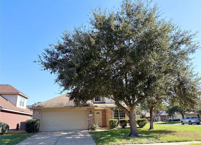 view of property hidden behind natural elements with a front lawn