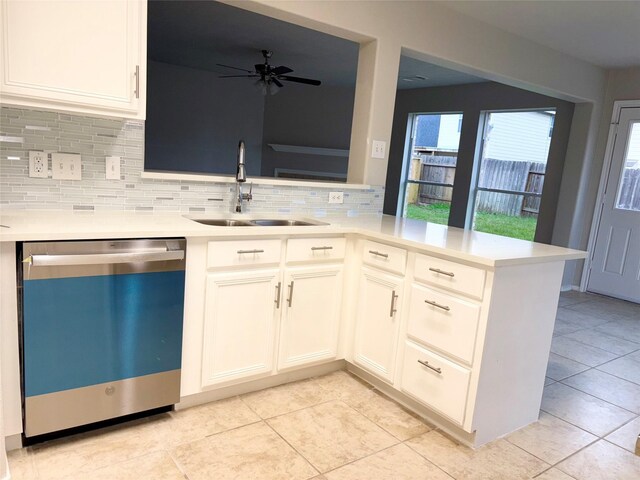 kitchen featuring kitchen peninsula, ceiling fan, sink, white cabinetry, and stainless steel dishwasher