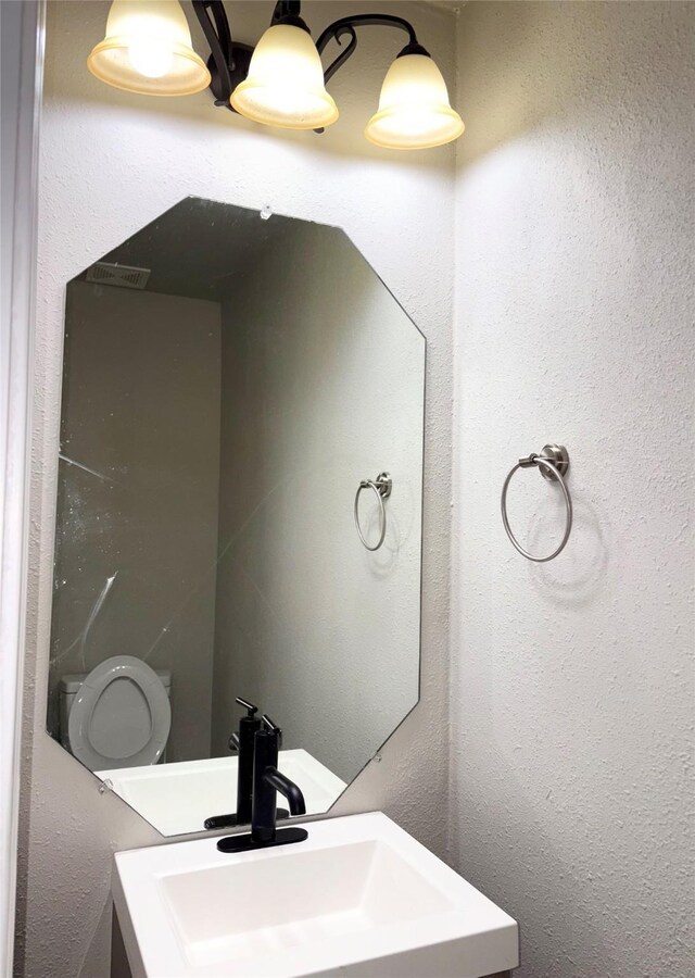 bathroom with toilet and sink