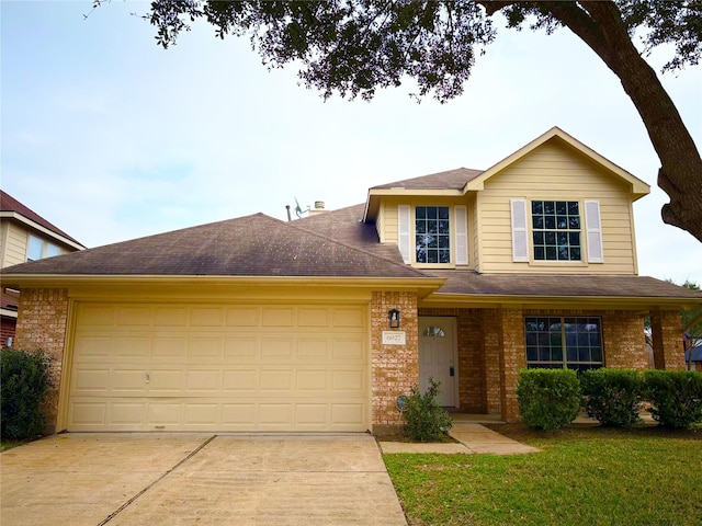 front facade with a garage and a front yard