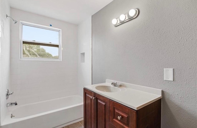 bathroom with vanity and bathing tub / shower combination