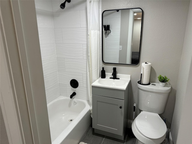 full bathroom with tile patterned flooring, vanity, toilet, and shower / bath combo with shower curtain