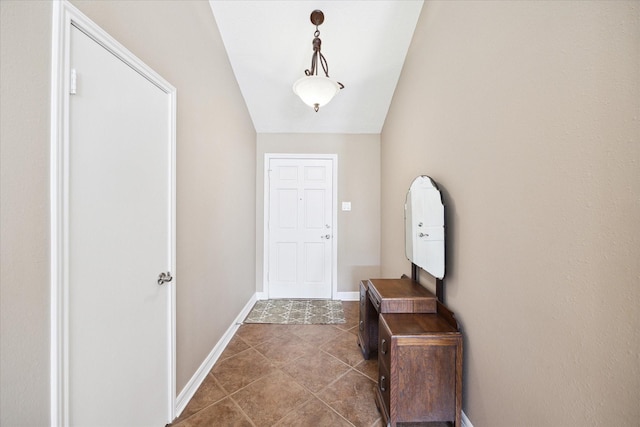 entryway with vaulted ceiling