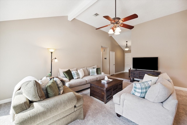 carpeted living room with beamed ceiling, ceiling fan, and high vaulted ceiling