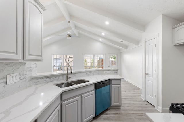 kitchen with light stone countertops, ceiling fan, sink, lofted ceiling with beams, and dishwasher