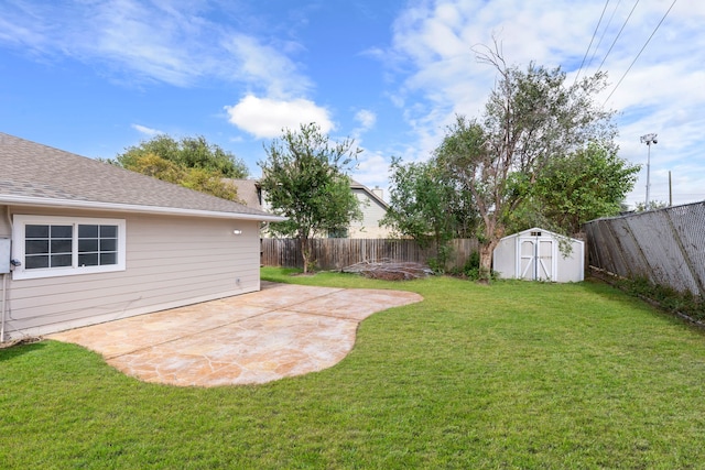 view of yard with a patio and a storage unit