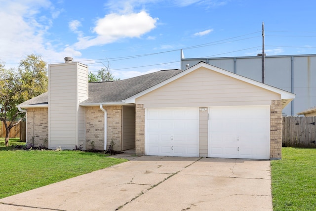 single story home with a garage and a front lawn