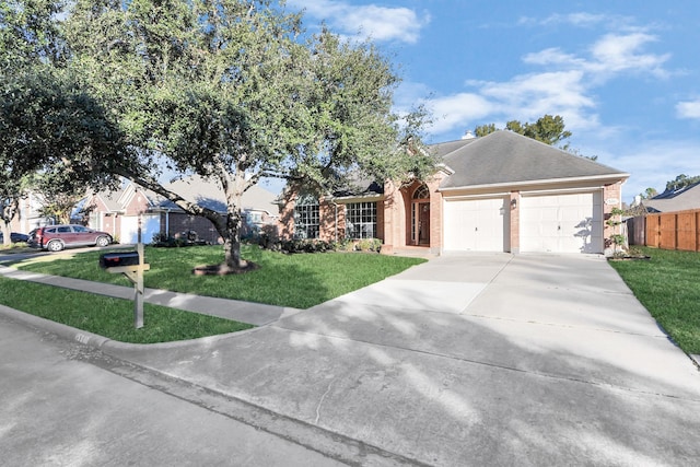 view of front of house with a garage and a front yard