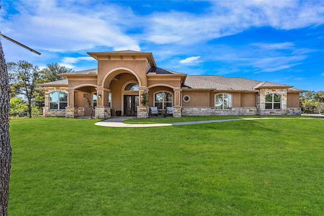 rear view of property featuring a yard