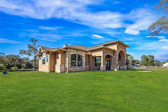 back of house with a yard