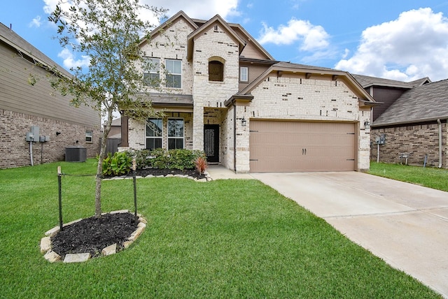 view of front of home featuring a front lawn, cooling unit, and a garage