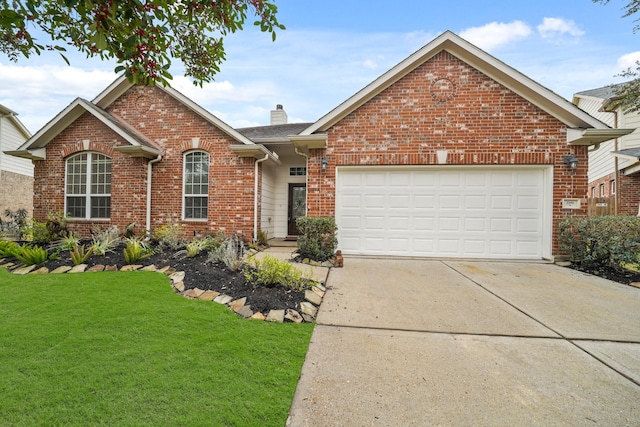 view of property with a garage and a front yard