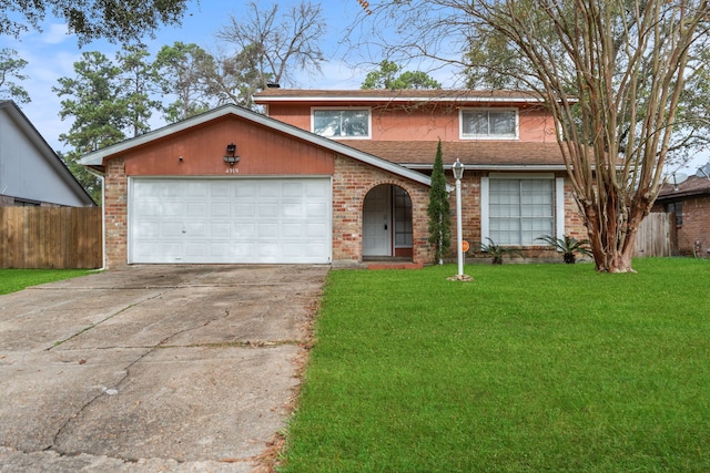 view of front of home with a front lawn and a garage