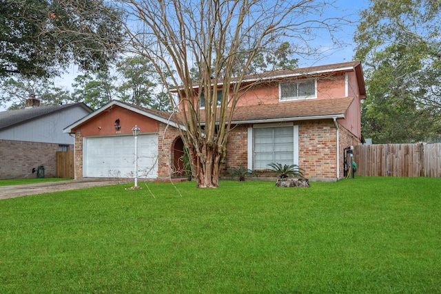 view of front of house with a front yard and a garage