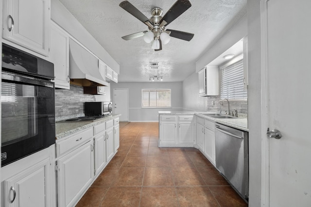 kitchen featuring backsplash, sink, white cabinets, and stainless steel appliances