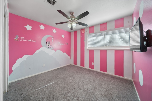 unfurnished room featuring carpet flooring and ceiling fan