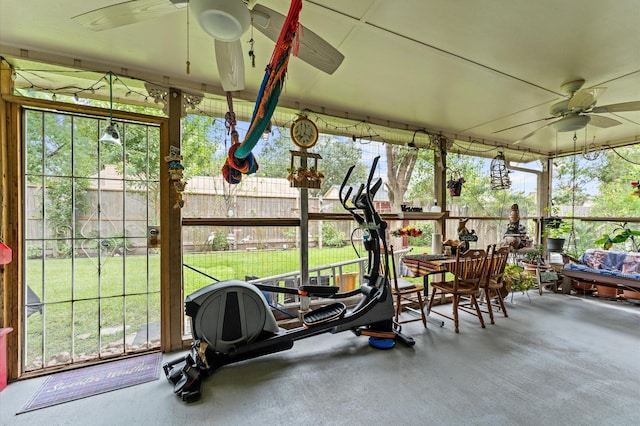 sunroom / solarium featuring ceiling fan